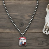 Necklace with a pendant featuring a cowboy image on a white background